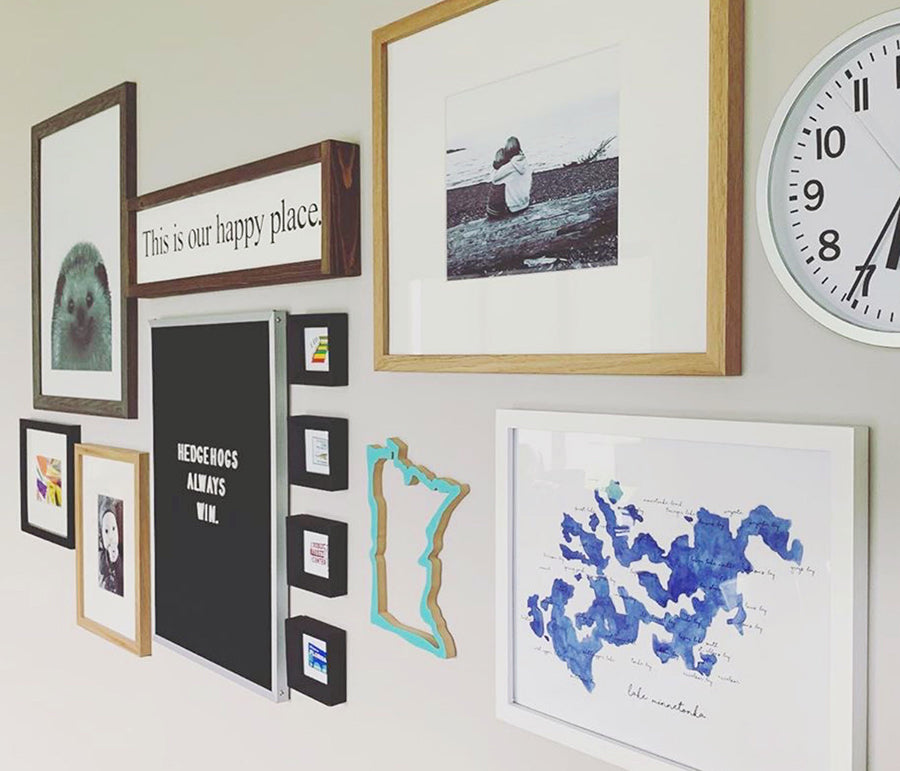 gregg lindberg's gallery wall featuring state icon landmark prints by united goods