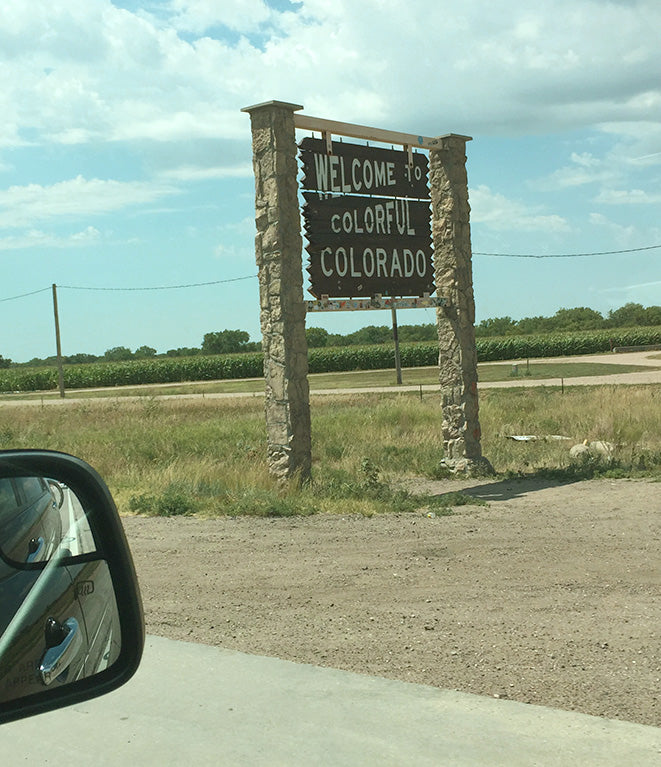 welcome to colorado sign on the highway by united goods