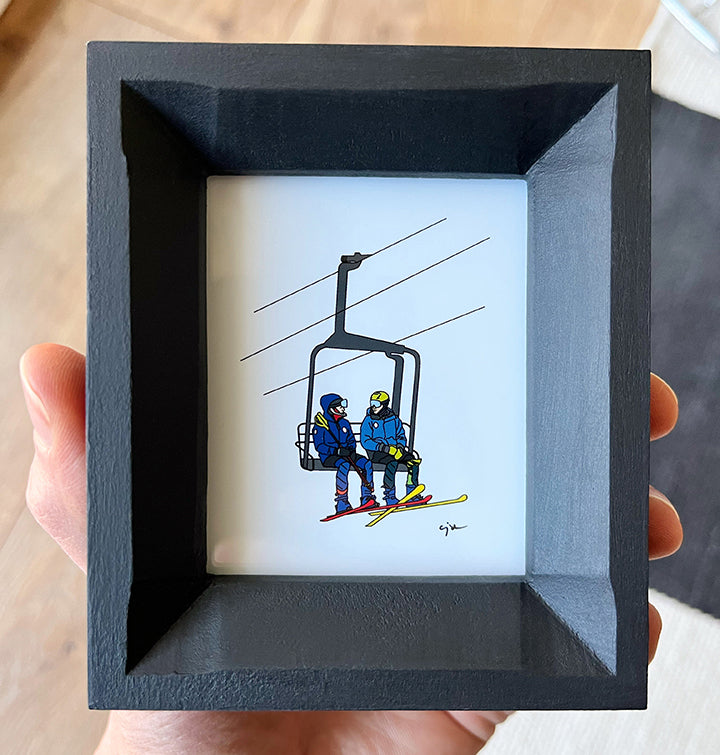 custom illustration by united goods of two friends on a ski chairlift